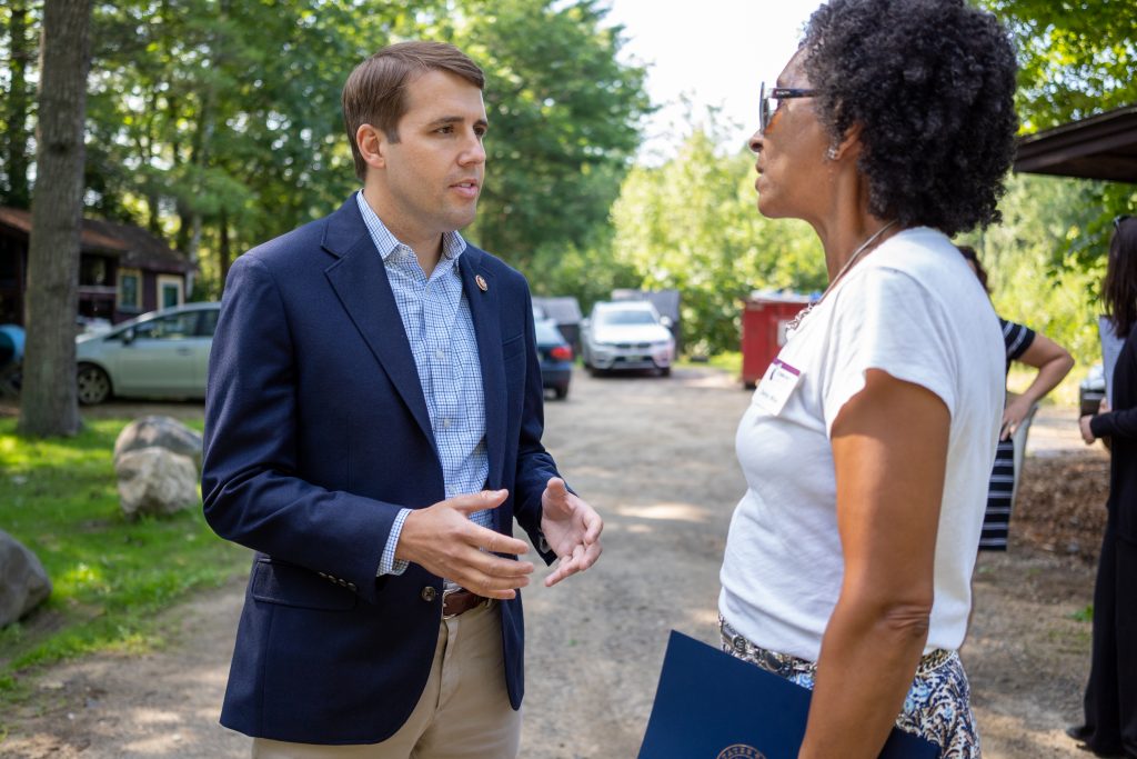 NH Congressman Chris Pappas talks with the Community Loan Fund's Debby Miller